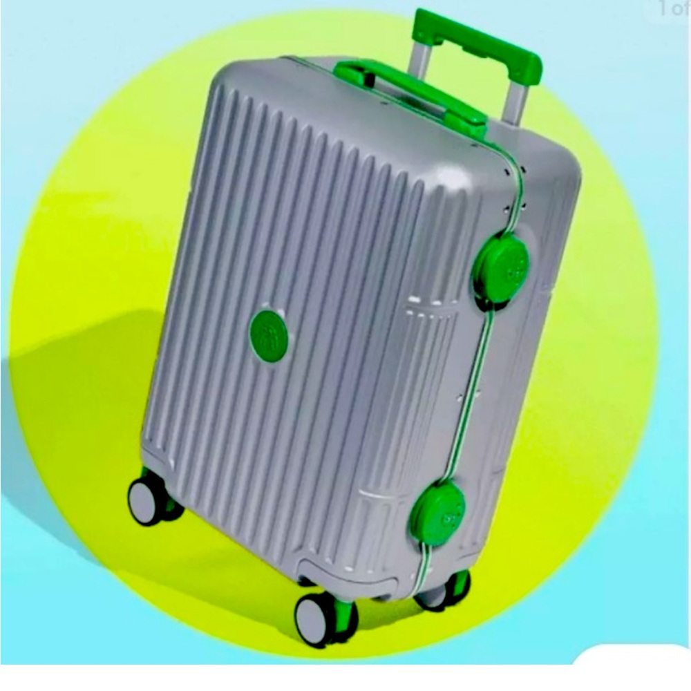 Drunk elephant Silver Suitcase with Green Accents (Carey on ) must go !